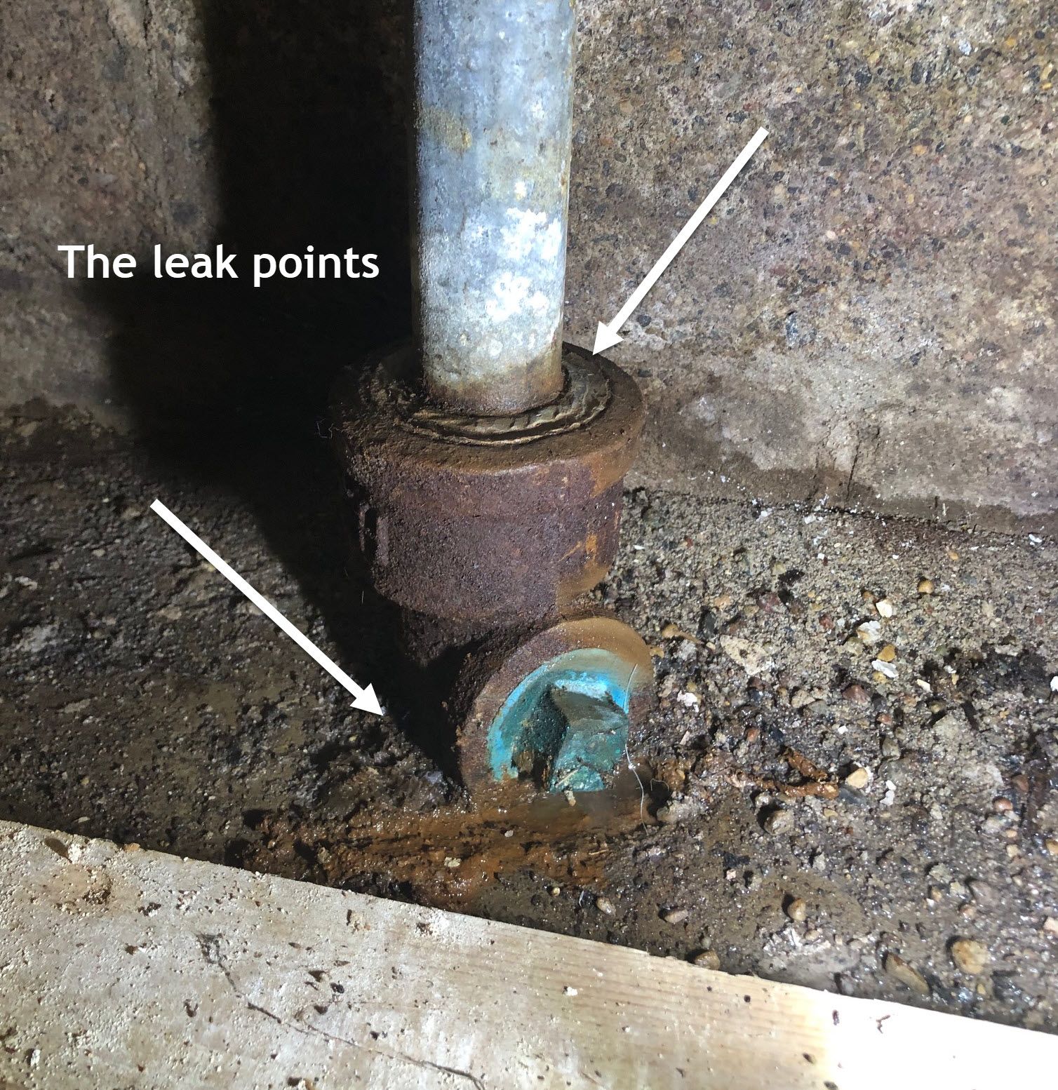 Picture showing the kitchen plumbing stack and two leak points.