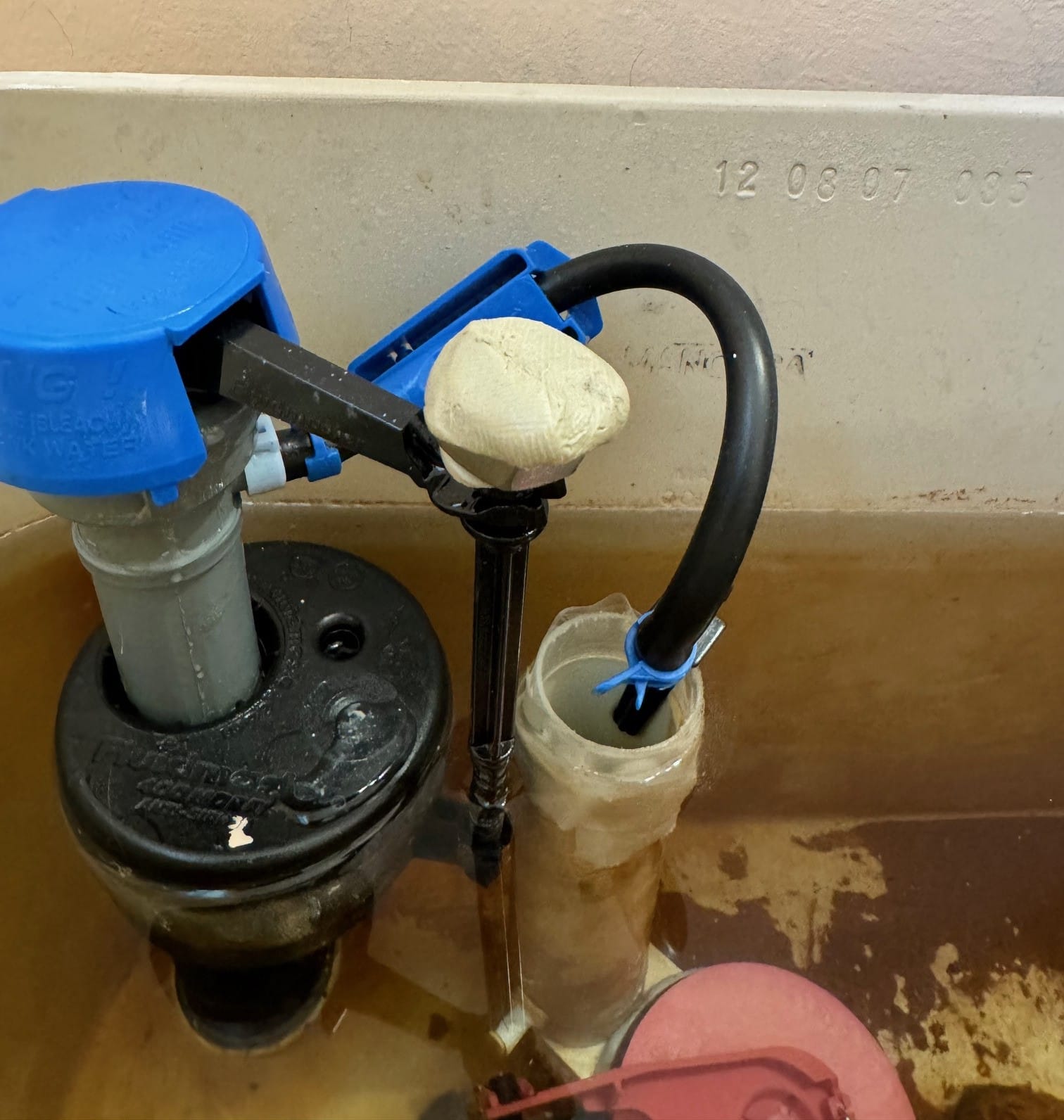 This sticking float was fixed with Plumber's Putty and a stainless-steel nut.