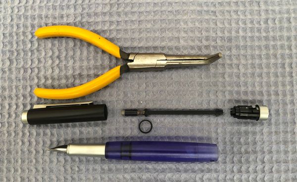 Disassembled Pelikan Level 5 with tools