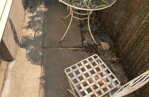 Corks serving as a nice caulking alternative, filling a gap in our sidewalk.